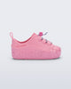 Side view of a pink Bloomy Sneaker with lilac laces and flower details on the sole