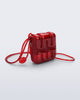 Front view of a red Jelly Wallet with inside pocket and zipper