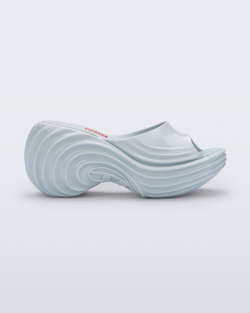 Side view of a light blue Platforms + Diesel slides