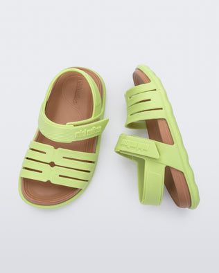 Top and side view of a pair of green with brown insole Kaiteki baby sandals