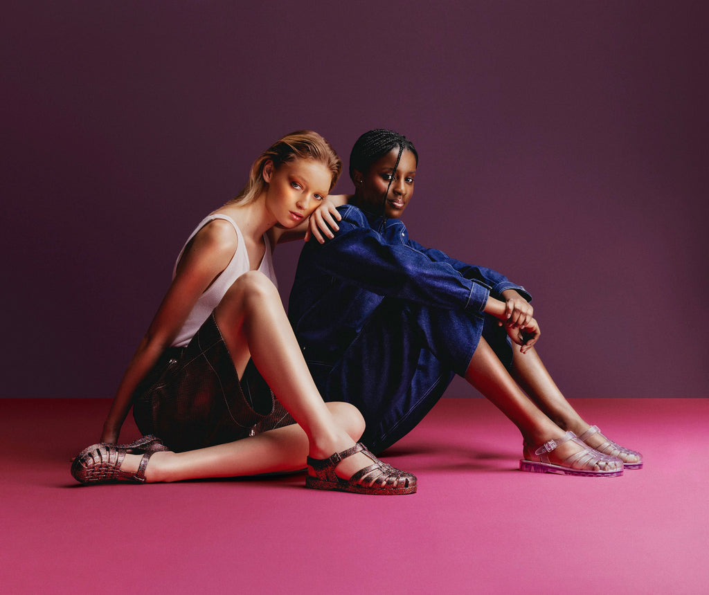 Models wearing the Possession sandals in clear and multi glitter glass