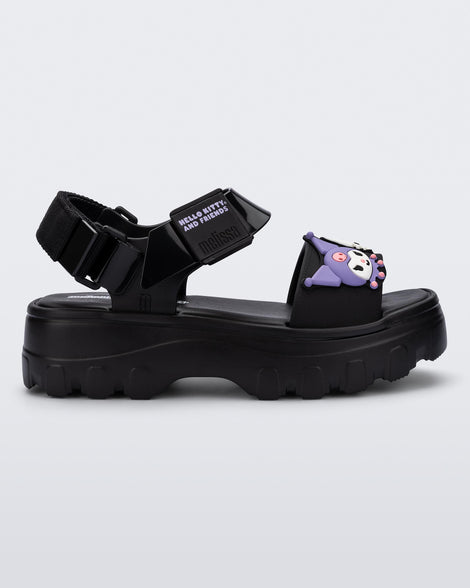 Side view of a black Kick Off Sandal + Hello Kitty and Friends with Hello Kitty and Friends on the upper strap