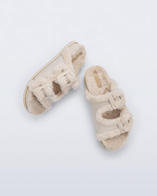 Top and side view of a pair of beige Cozy Warm Slides with beige fuzzy insoles