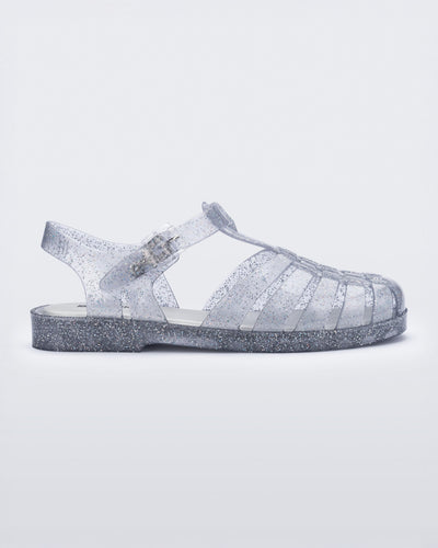 Side view of glitter clear silver Possession fisherman sandal