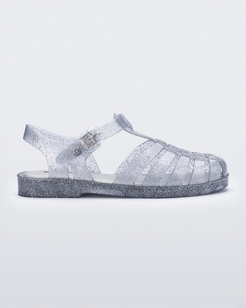 Side view of glitter clear silver Possession fisherman sandal