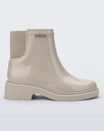 Side view of a beige Chelsea boot