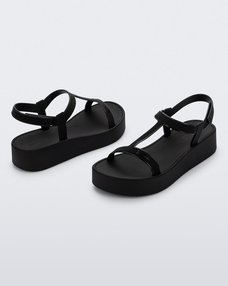 Back and angled view of a pair of black Sun Capri Platform sandals with ankle straps