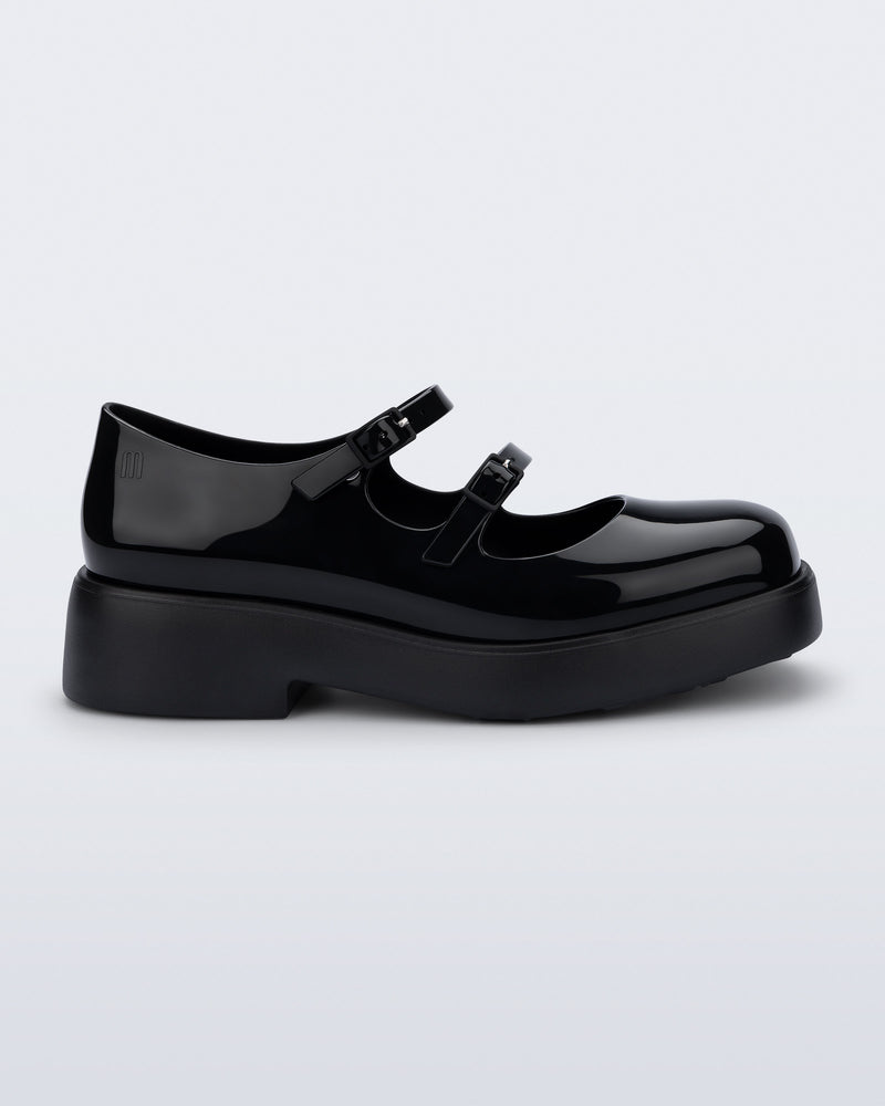 Side view of a black Farah Low Mary jane loafer