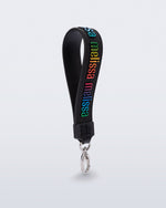 Angled view of a black M Lover Charm with the Melissa logo in rainbow colors