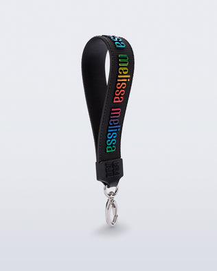 Angled view of a black M Lover Charm with the Melissa logo in rainbow colors