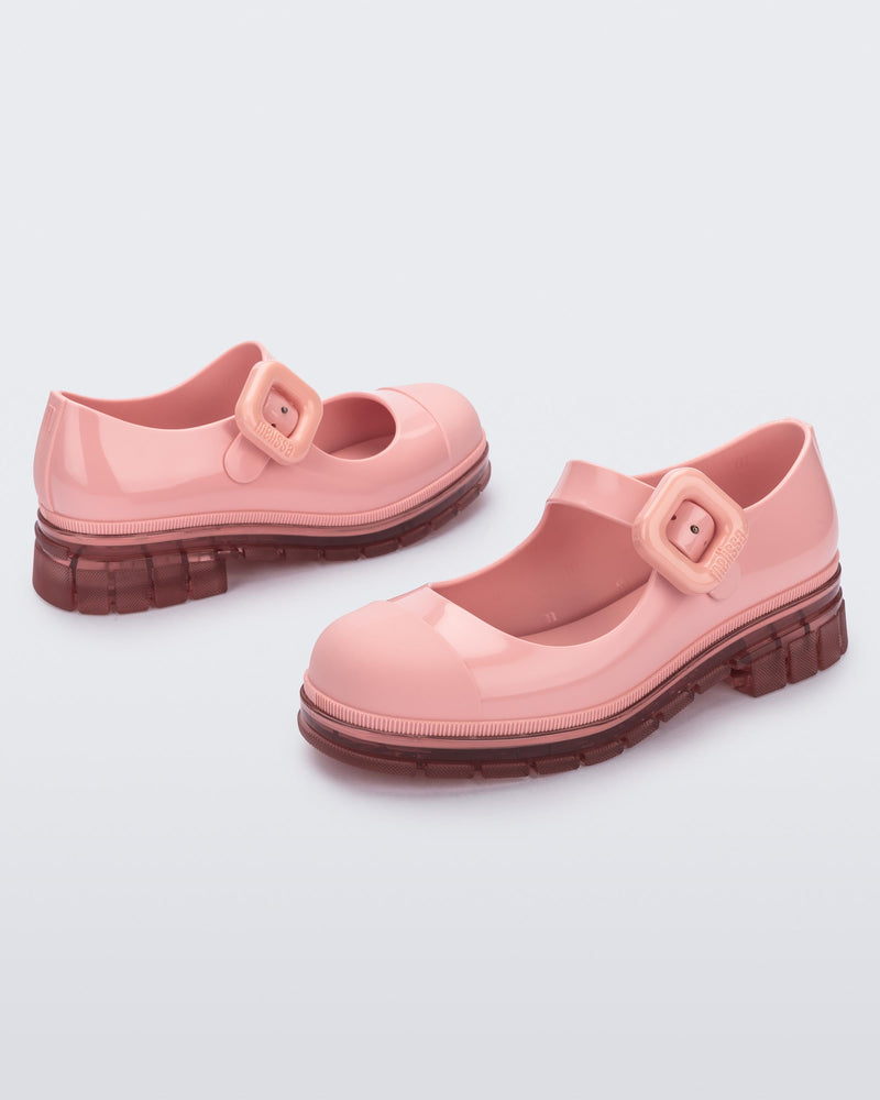 Back and side angle view of a pair of pink June mary janes with matte toe cap
