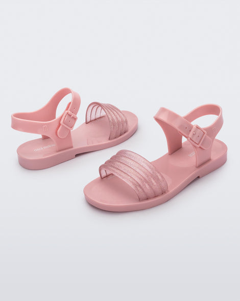 Angled view of a pair of pink Mar Wave kids sandals.