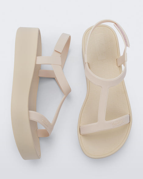 Top and side view of a pair of beige Sun Capri Platform sandals with ankle straps