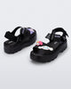 Back and angled view of a pair of black Kick Off Sandals + Hello Kitty and Friends with Hello Kitty and Friends on the upper strap