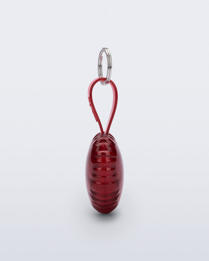 Side view of a red Heart bag charm