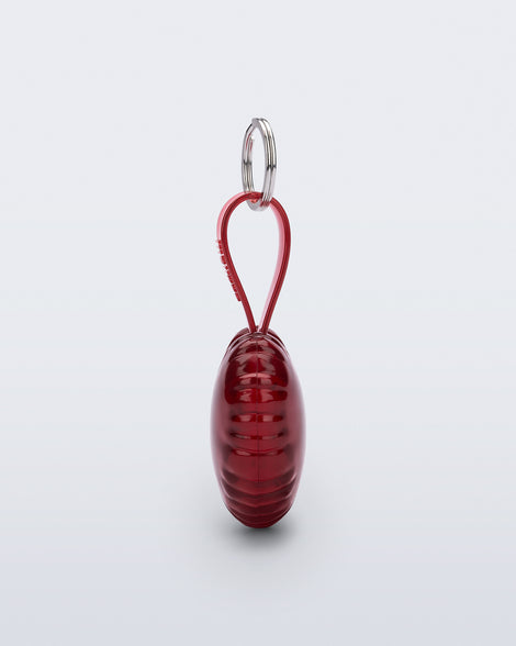 Side view of a red Heart bag charm