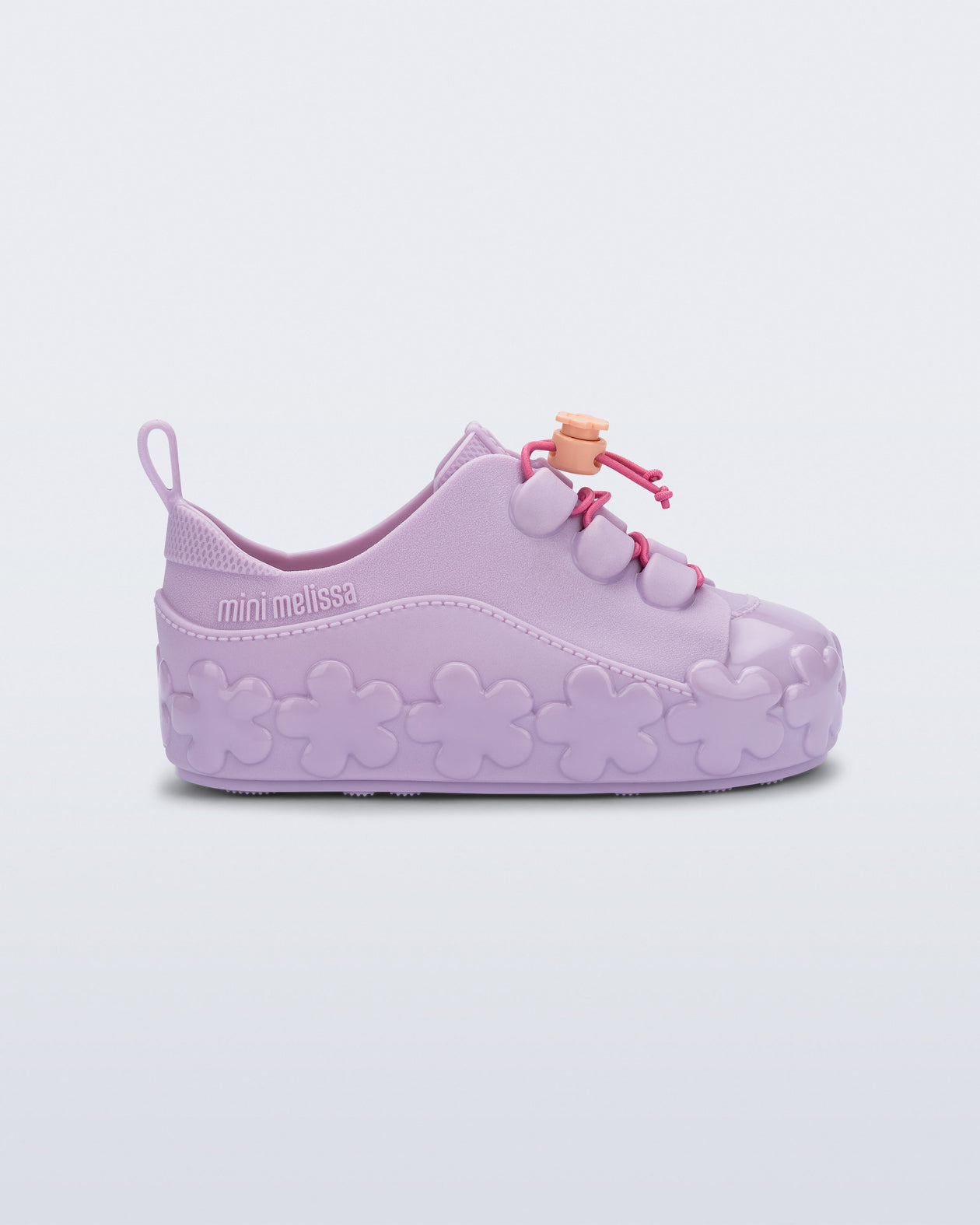 Side view of a purple Bloomy Sneaker with pink laces and flower details on the sole