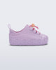 Side view of a purple Bloomy Sneaker with pink laces and flower details on the sole