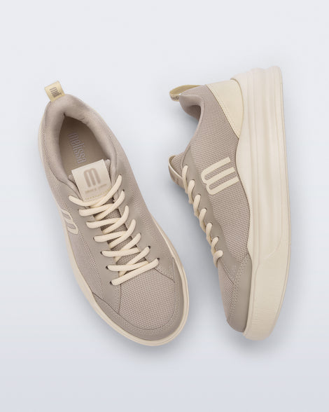 Top and side view of a pair of beige X Mood sneakers