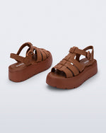 Back and angled view of a pair of brown Up Platform sandals