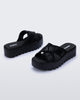 Back and side view of a pair of black M Lover Cross Strap platform slides