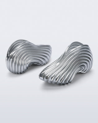 Side and back angled view of a pair of silver Quantum Sneakers