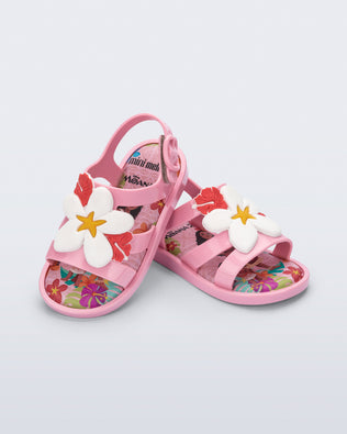 Angled view of a pair of pink Colorland Moana baby sandals
