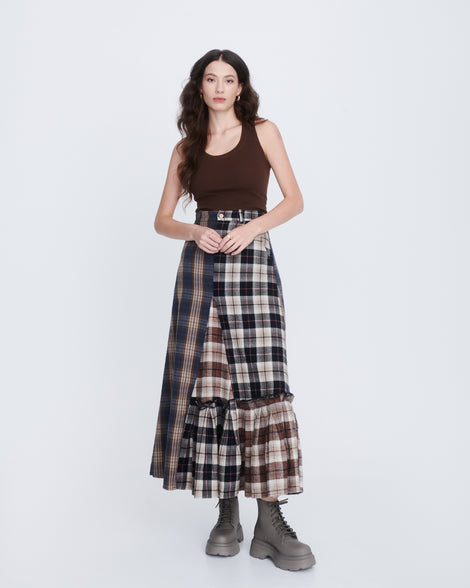 Model in a brown plaid long skirts and brown tank wearing a pair of matte brown Coturno Soft Platform boots