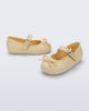 Side and angled view of a pair of yellow Soft Ballerina Delicate Bow baby flats with top strap and bow