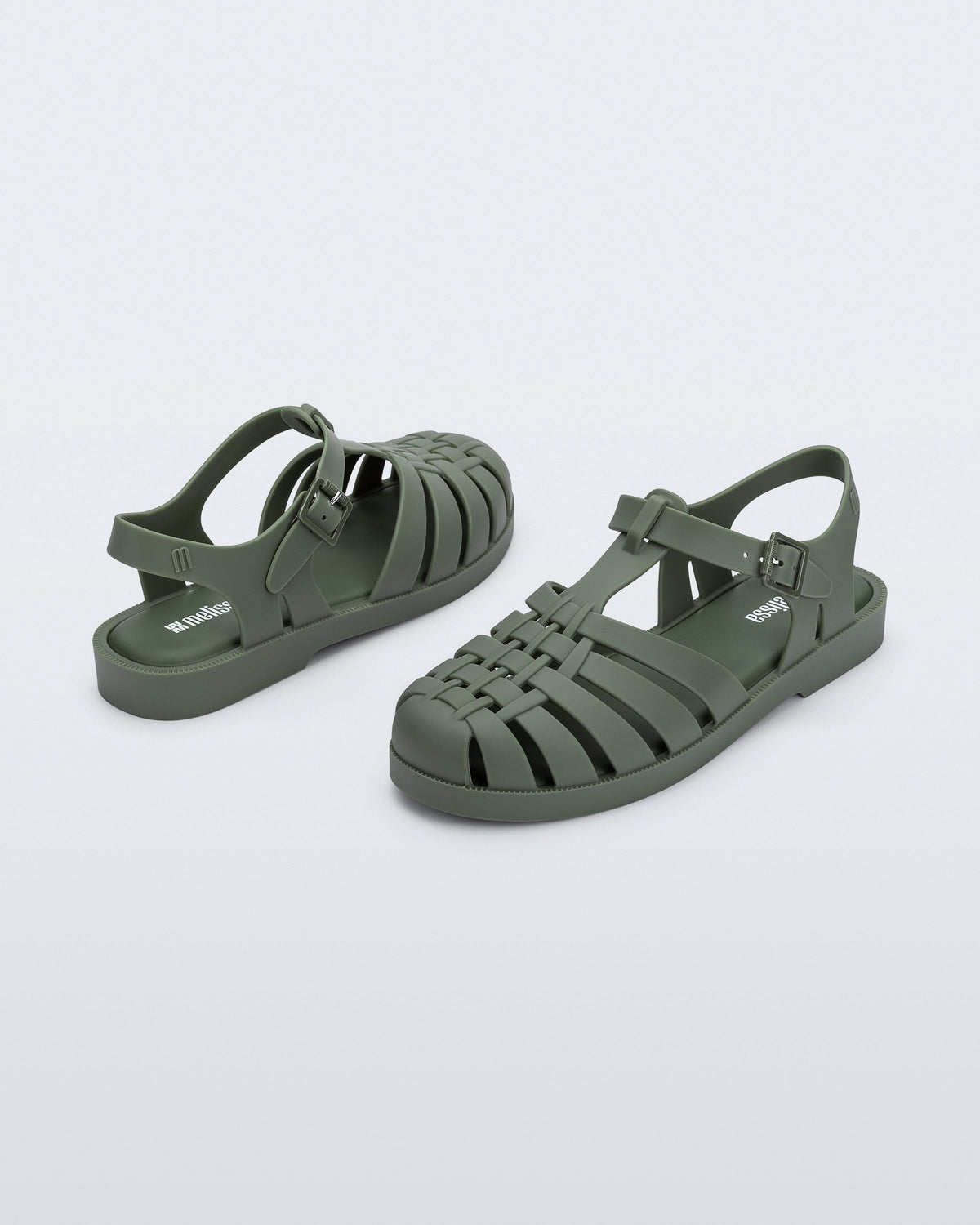 Back and angled view of a pair of dark green Possession fisherman sandals