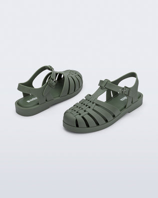 Back and angled view of a pair of dark green Possession fisherman sandals