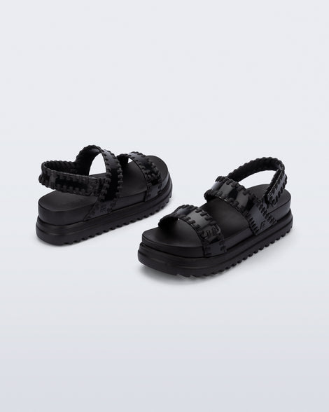 Back and angled view of a pair of black Dune Platform Sandals with faux stitching on the straps