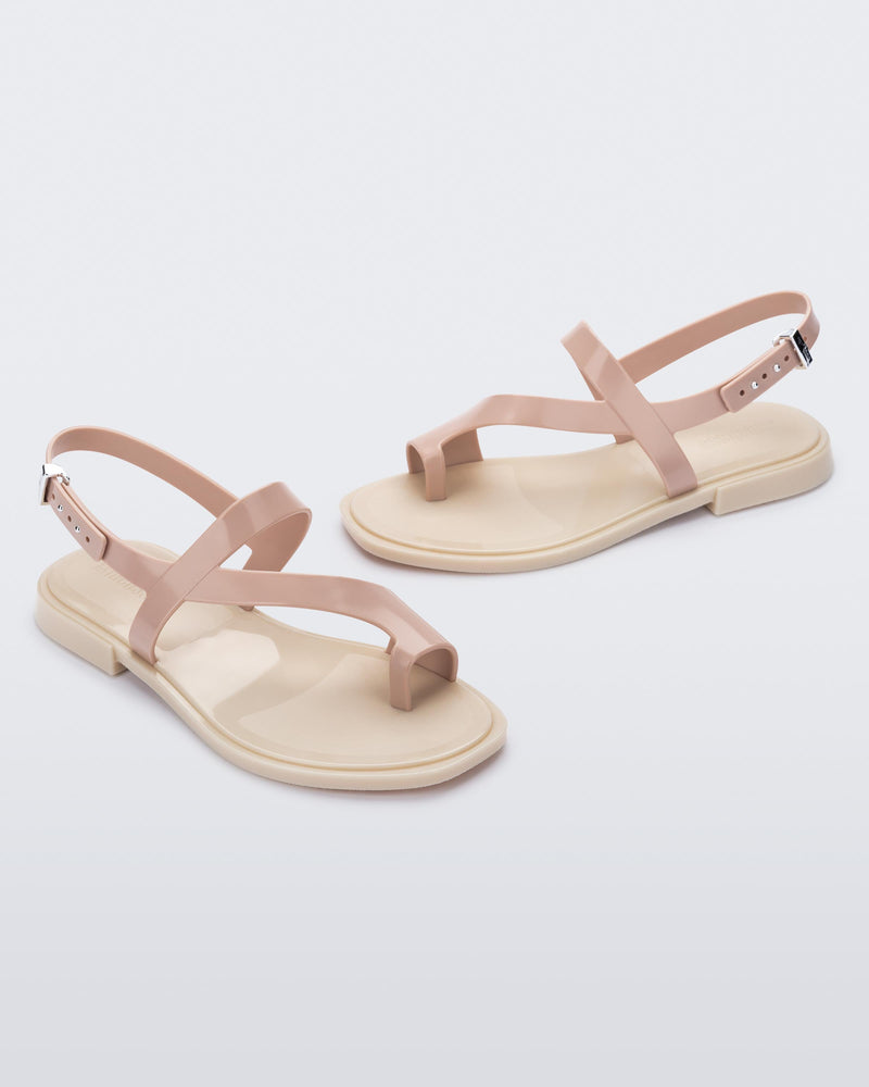 Angled view of pair of pink Cassie sandals.