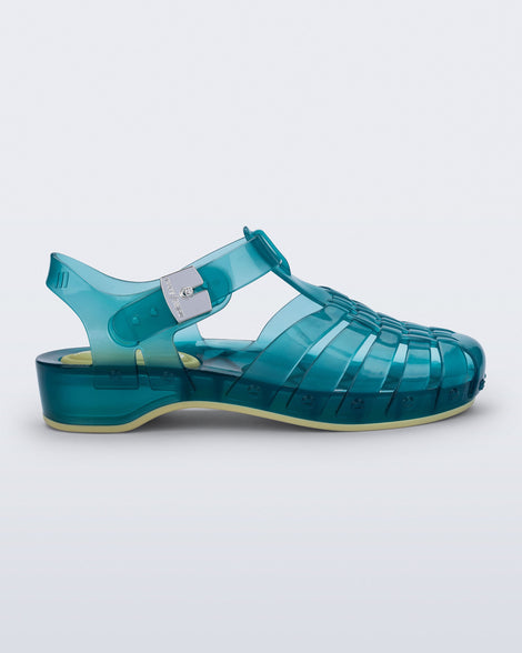 Side view of a blue Possession Pescura + Scholl fisherman sandal with white bottom sole
