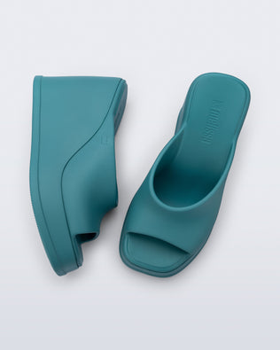 Top and side view of a pair of blue/green Free Slip platform wedge heels