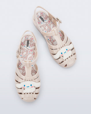 Top view of a pair of beige Possession + Hello Kitty and Friends fisherman sandals with Hello Kitty and friends on the upper