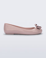 Side view of a pink Sweet Love Glam ballerina flat with pink chrome bow
