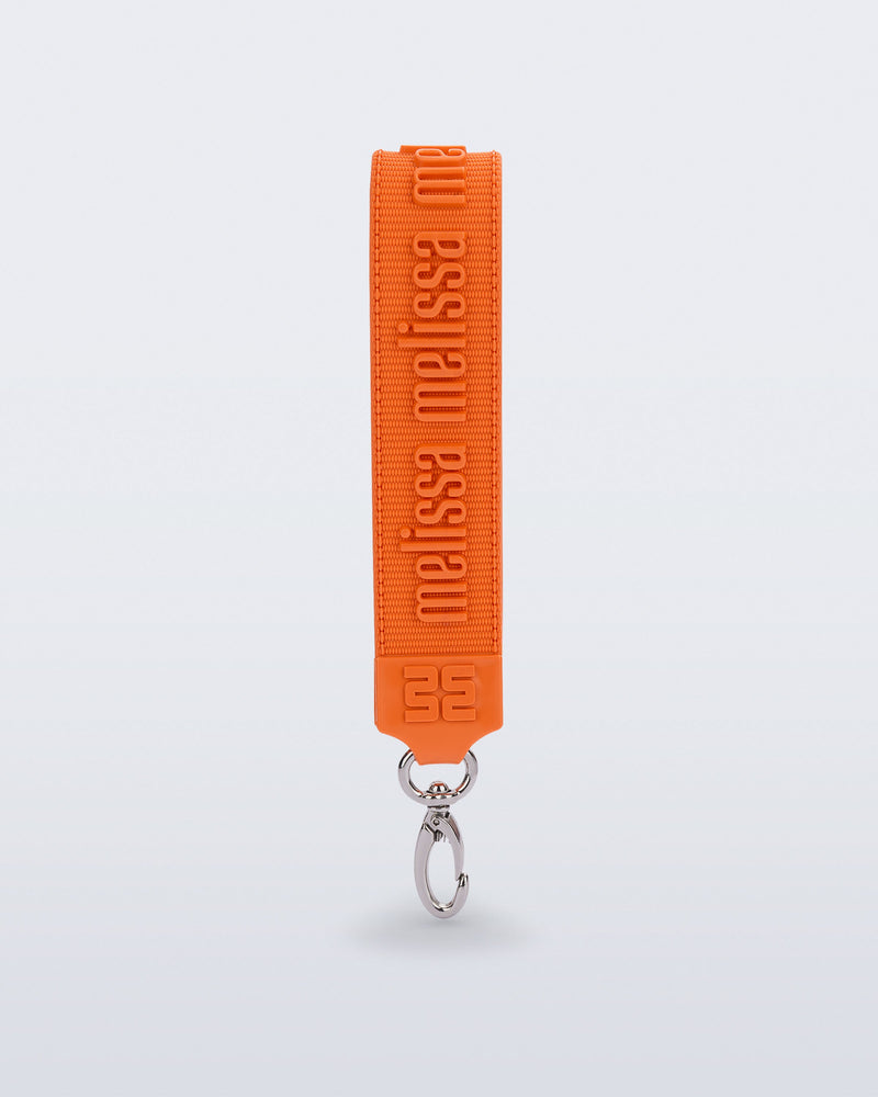 Front view of an orange M Lover Charm with the Melissa logo