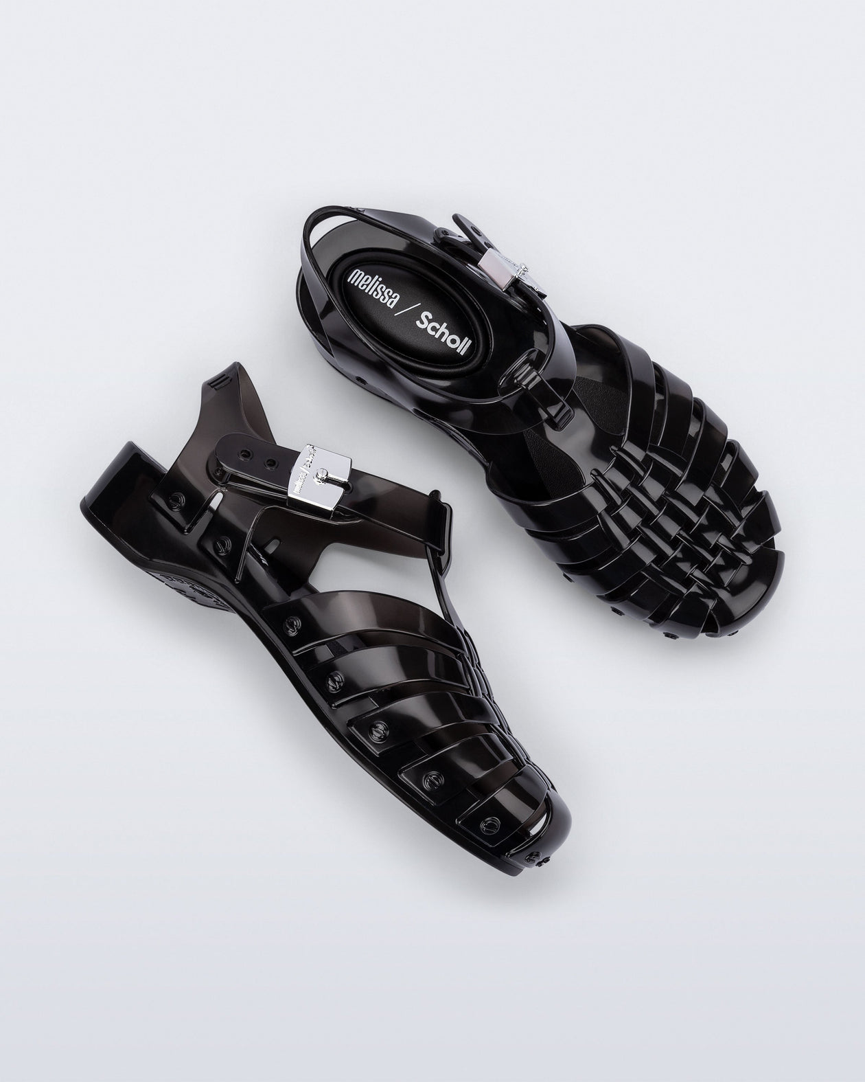 Side and top view of a pair of black Possession Pescura + Scholl fisherman sandals