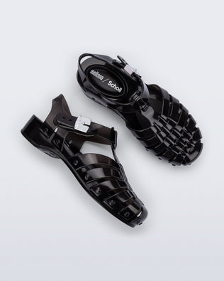 Side and top view of a pair of black Possession Pescura + Scholl fisherman sandals