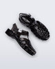 Side and top view of a pair of black Possession Pescura + Scholl fisherman sandals