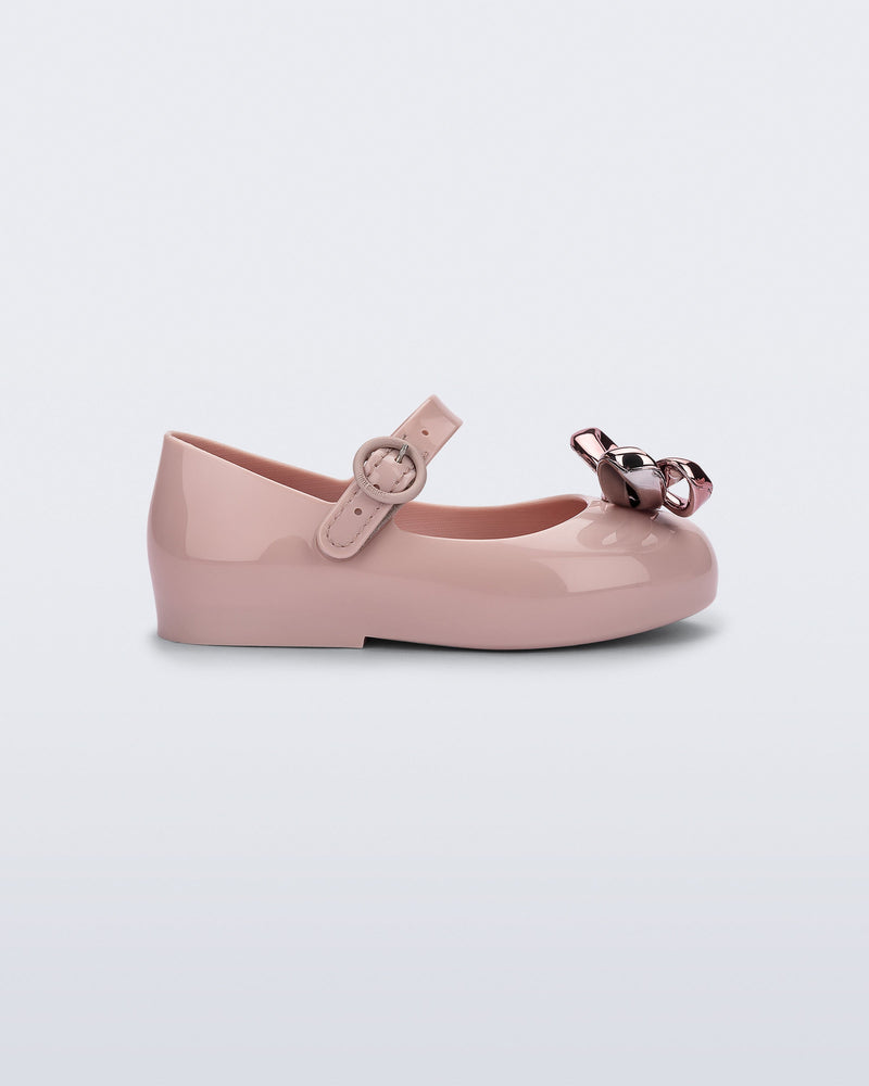 Side view of a pink Sweet Love Glam baby ballerina with bow