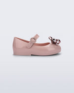 Side view of a pink Sweet Love Glam baby ballerina with bow