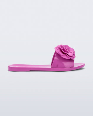 Side view of a pink Babe Petals slide sandal