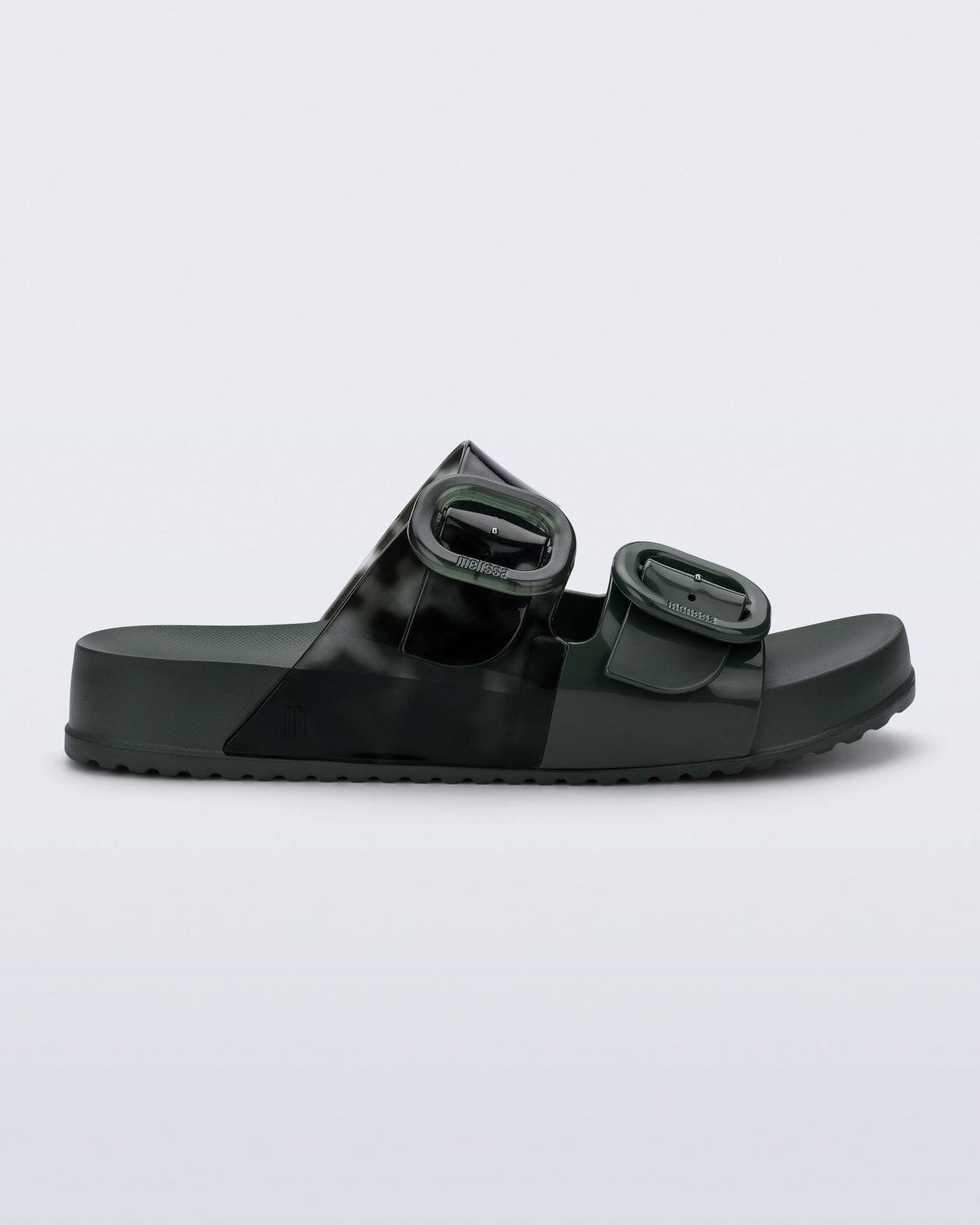 Side view of a dark green Cozy slide with part clear green upper with 2 buckles