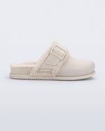 Side view of a beige Cozy Warm clog with fuzzy insole