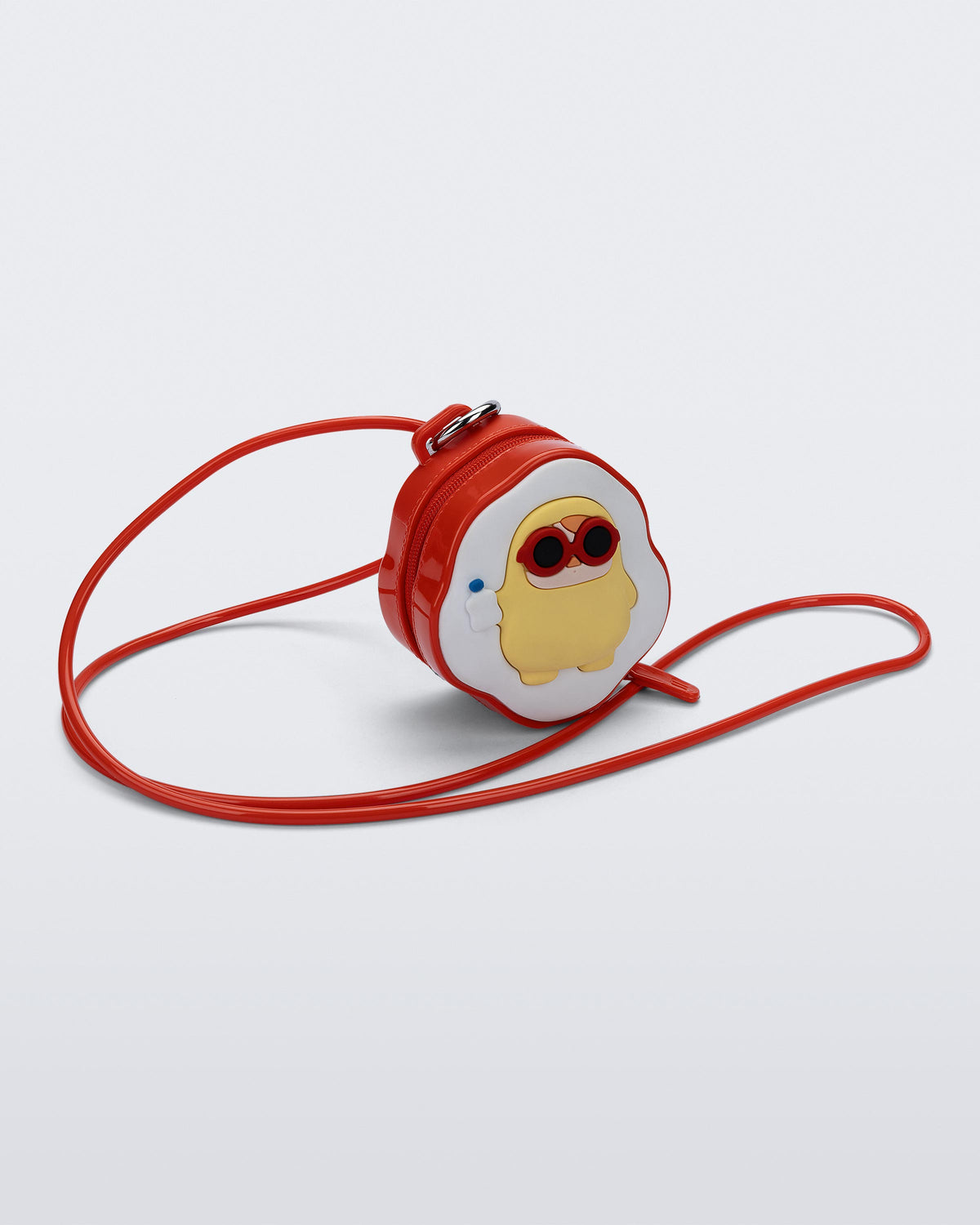 Angled view of a red Bag + Pop Mart Pucky small bag with short strap