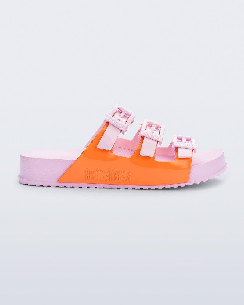 Side view of a pink and orange Cozy Stripe slide