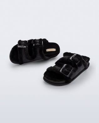 Top and angled view of a pair of black Cozy Warm Slides with black fuzzy insoles