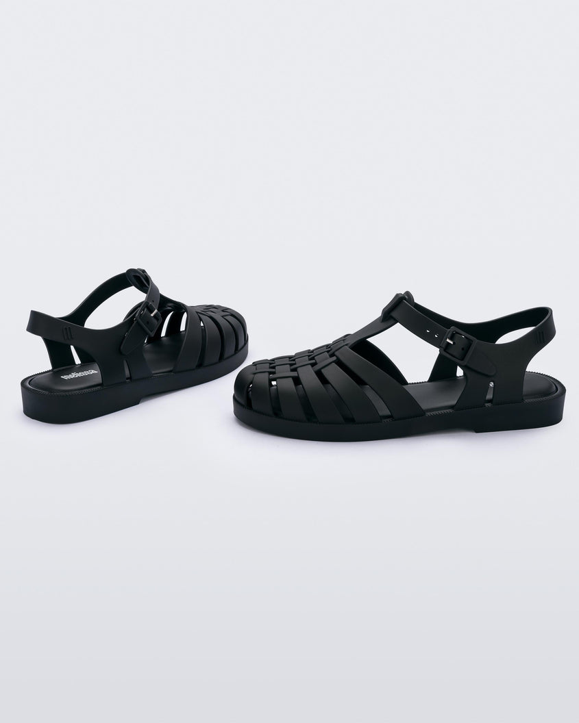 outer side view of a pair of Melissa Possession fisherman sandals in black with a matte finish, cut out fishermen strap detail and buckle closure.